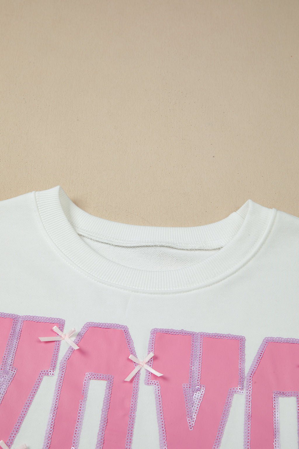 White Bow Sequin XOXO Letter Graphic Exposed Seam Baggy Sweatshirt